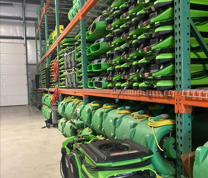 Warehouse wall of green SERVPRO machine equipment